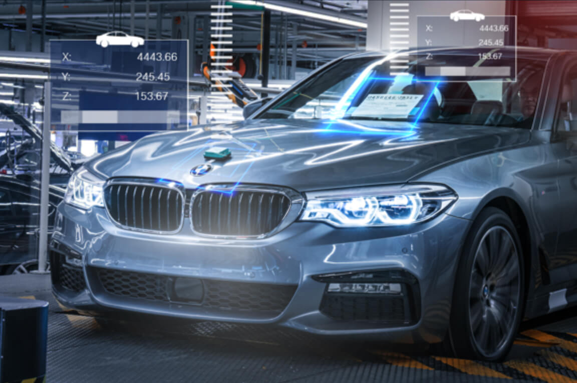 A car being manufactured with the help of tool control.