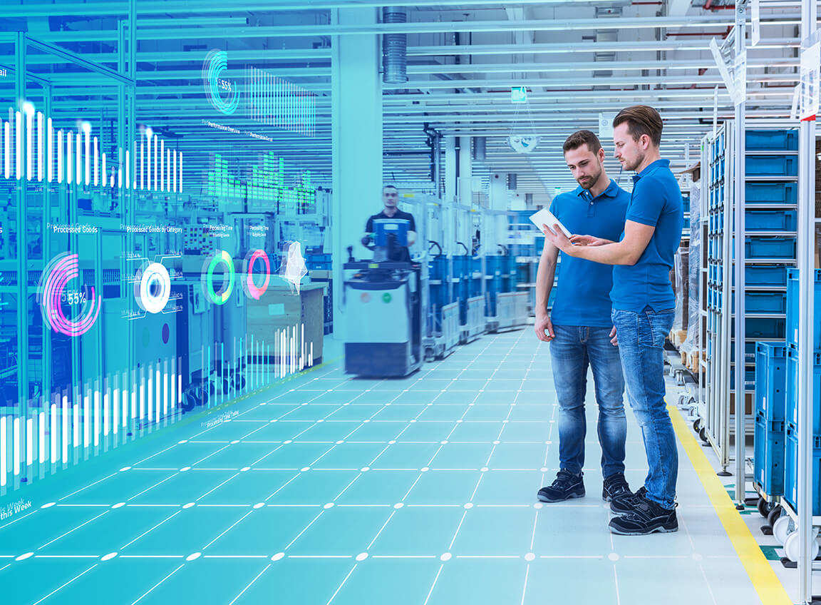 Two men in an automated factory.