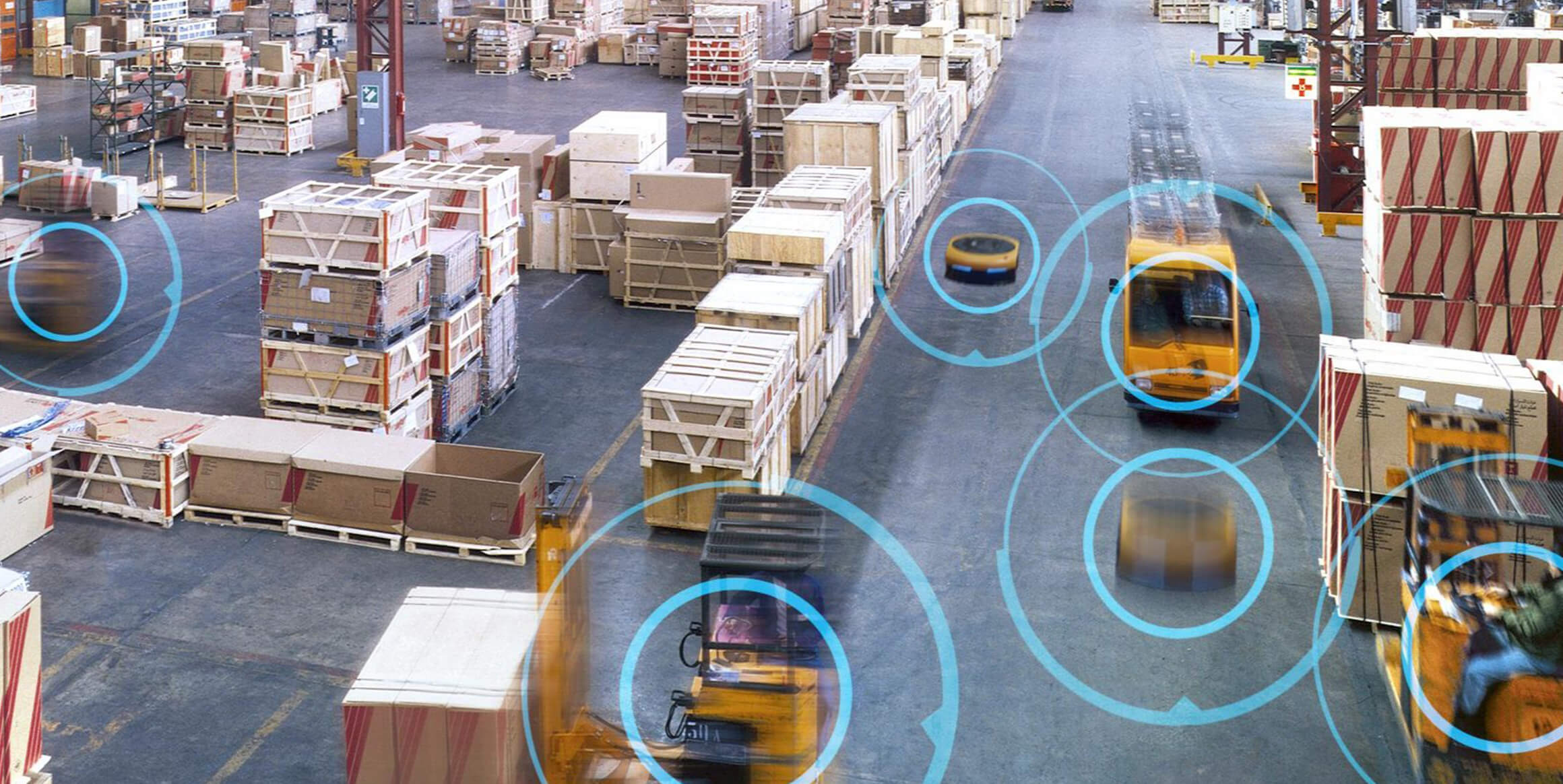 AMR and AGVs moving in a warehouse with the help of the fleet management software.