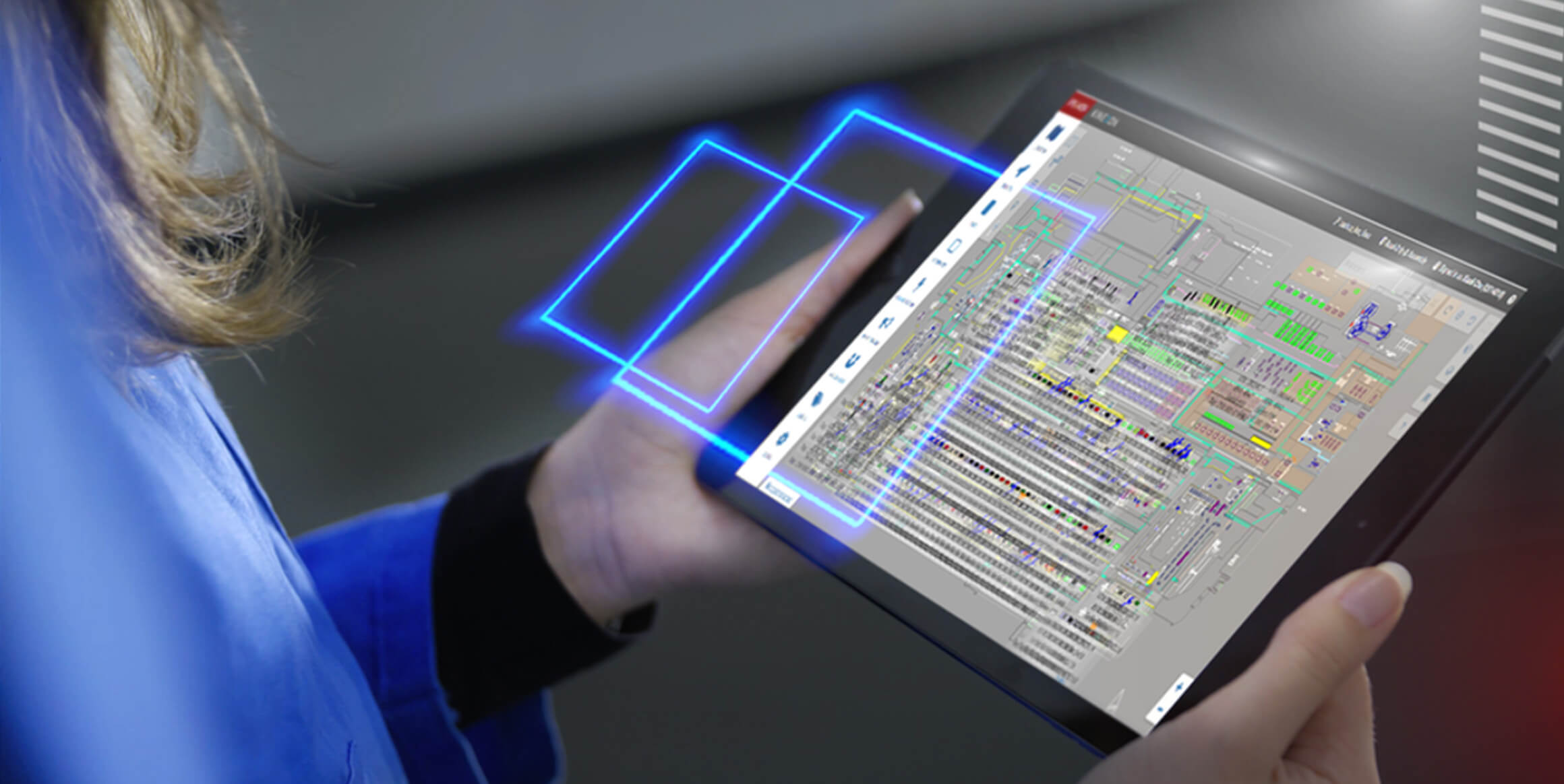 A person using a tablet to access the Kinexon OS software.