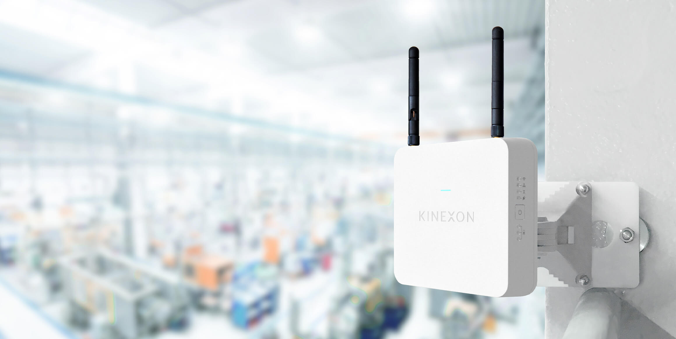 A Kinexon anchor mounted to a wall in a factory.