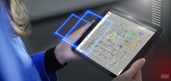 A person holding a tablet with the Kinexon OS application on it.