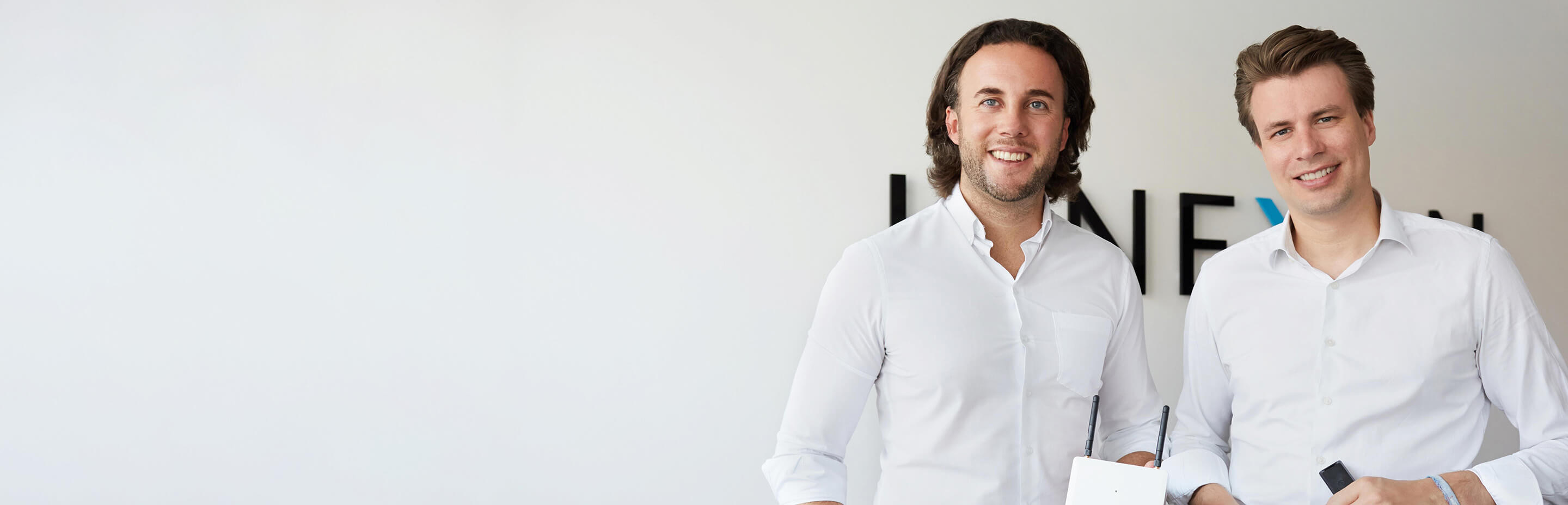 The two Kinexon founders in front of a white background.