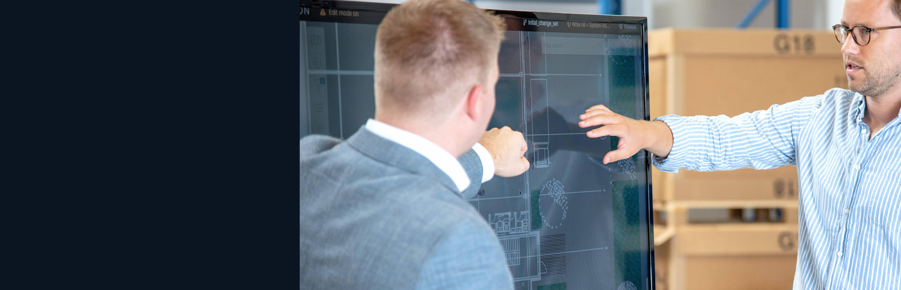 A hero image for the events page. Showing to people discussing a IoT solution.