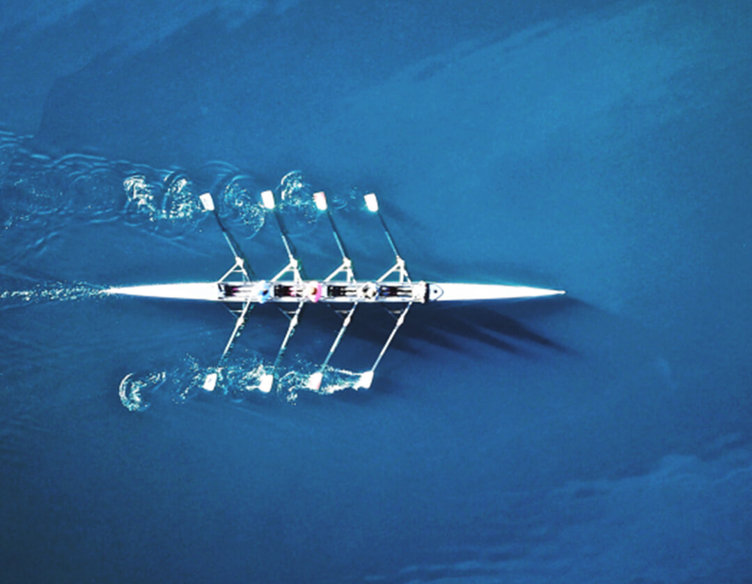 A rowing team on the water.